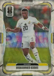 Front of 2026 Panini Prizm FIFA World Cup Soccer Mohammed Kudus #229 Prizm, upright portrait soccer card. A full-body image of Mohammed Kudus in a white Ghana kit appears against a multicolored stadium-like background. The…