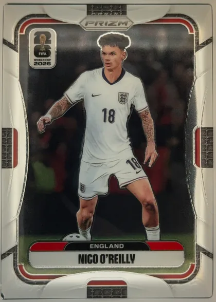 Front of 2026 Panini Prizm FIFA World Cup Soccer Nico O’Reilly #118 Base, portrait soccer card front. A full-body image of Nico O’Reilly in a white England kit occupies the central black-background image area. The FIFA…