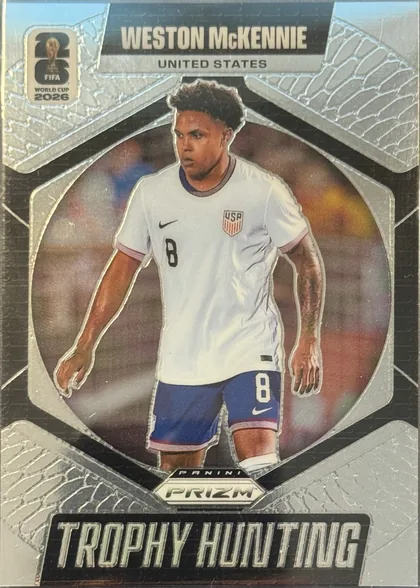 Front of 2026 Panini Prizm FIFA World Cup Soccer Weston McKennie #21, portrait-oriented soccer card front. The player's name appears in large white uppercase lettering on a black banner at the top, with UNITED STATES…