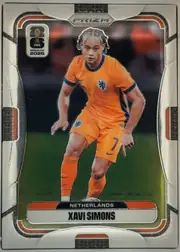 Front of 2026 Panini Prizm FIFA World Cup Soccer XAVI SIMONS #313 Base, portrait-oriented soccer card front. A full-body action image of Xavi Simons in an orange Netherlands kit occupies the center. The FIFA World Cup…