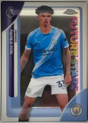 Front of 2026 Topps Chrome Premier League Soccer Nico O’Reilly #130, front of a portrait soccer card featuring Nico O'Reilly in a Manchester City blue uniform, standing in a full-body action pose. The name Nico…
